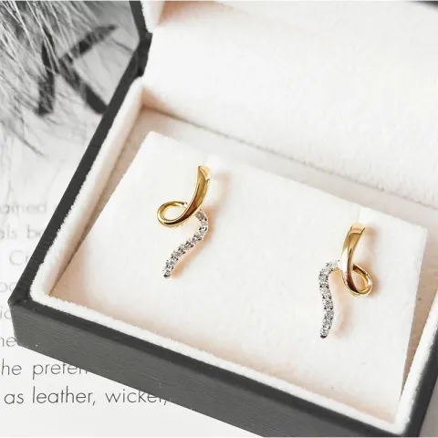 Diamant ohrringe in 14 karat gold und weißgold mit diamanten