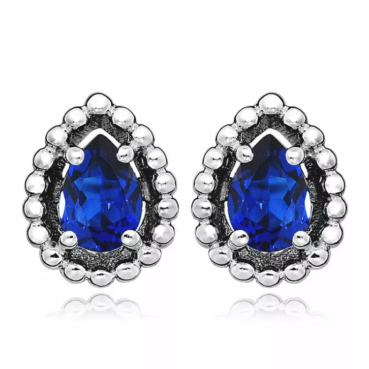 Tropfen blauem Ohrstecker in rhodiniertem Silber