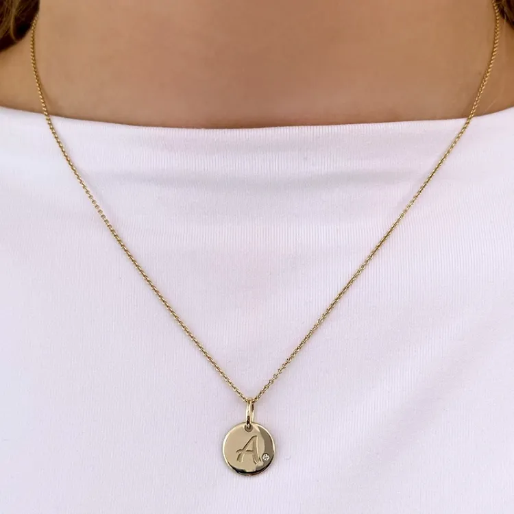 Buchstab a diamant anhänger in 9 karat gold 0,01 ct