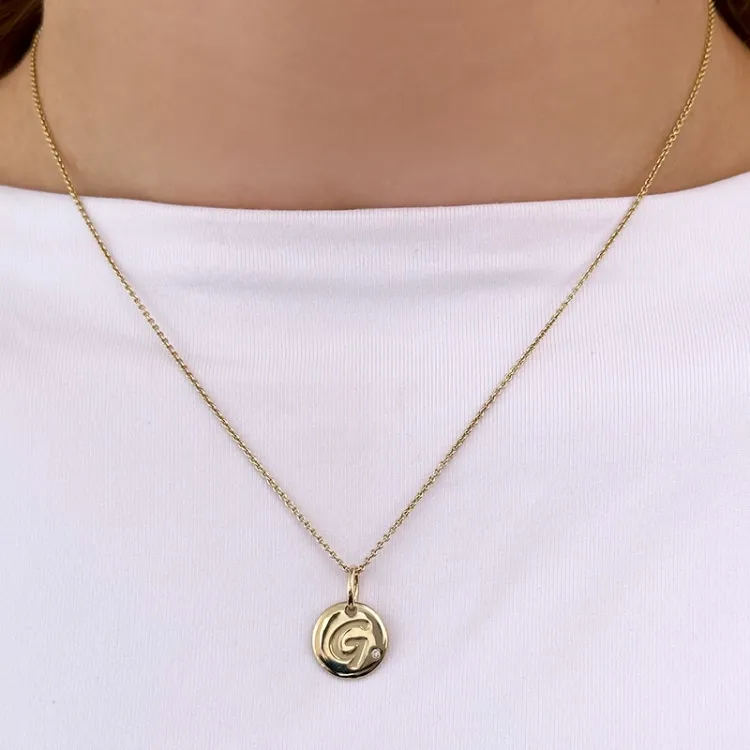 Buchstab g diamant anhänger in 9 karat gold 0,01 ct
