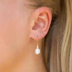Ovalen 7 - 8 mm süßwasserperle, aaa-qualität brillantohrringen in 14 karat gold mit diamanten 